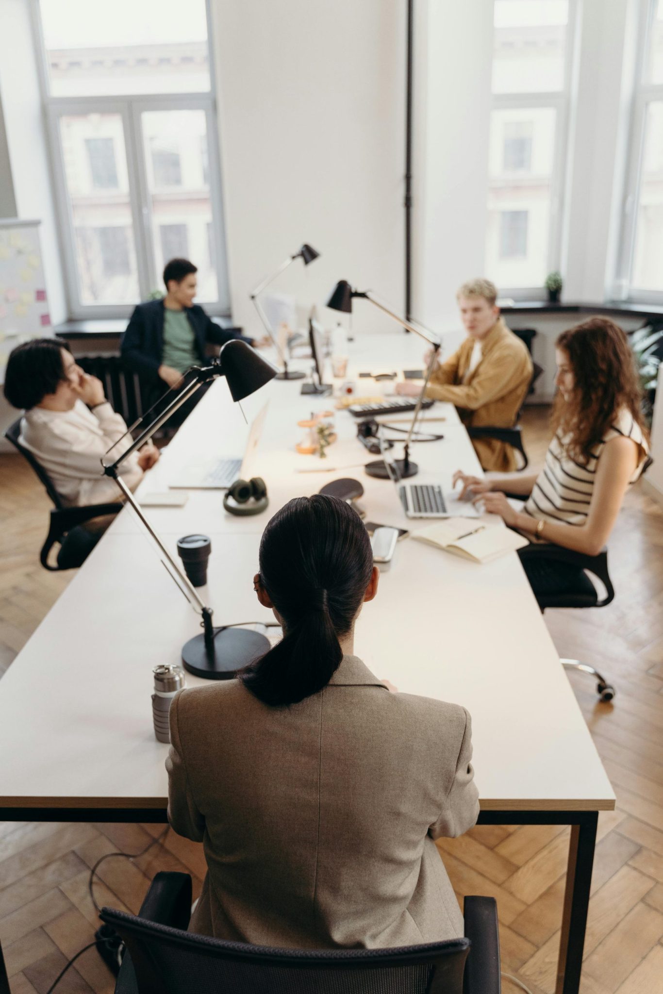 Optometry Billing Services for Dallas, TX Eye Care Providers 1 A professional medical office environment with a team of optometry professionals working at desks on their computers for Dallas Optometry Medical Billing Team Collaborating